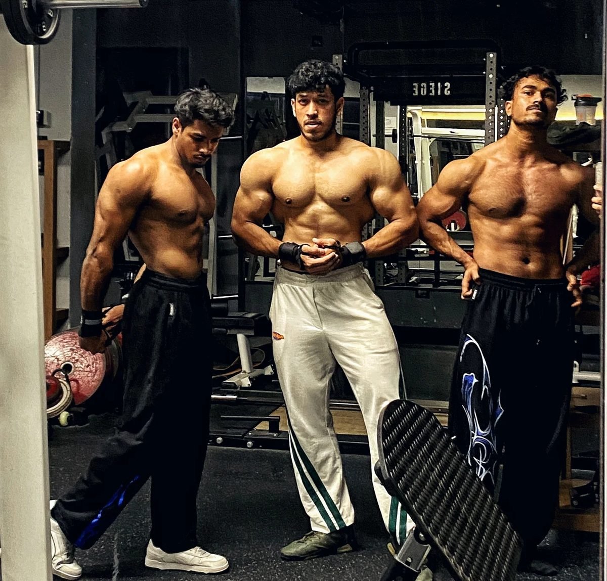 Athletes preparing on the Muscle Mansion floor