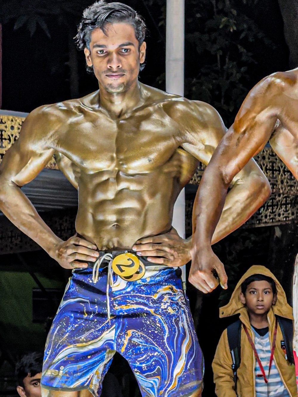 Akash Basak posing at the Mr. Assam bodybuilding championship